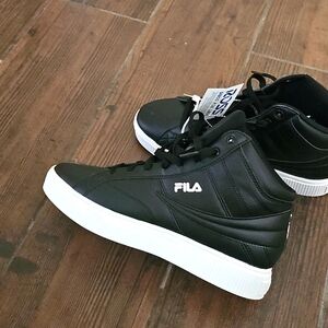 Women size 10 leather high top Filas